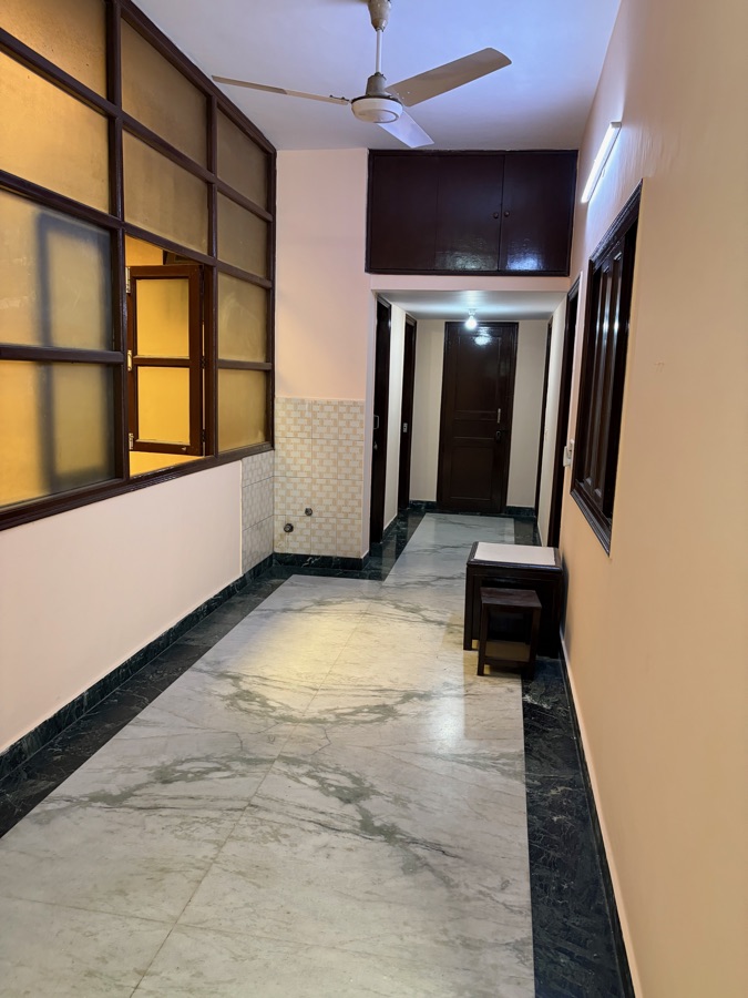 Wide common corridor with ceiling fan