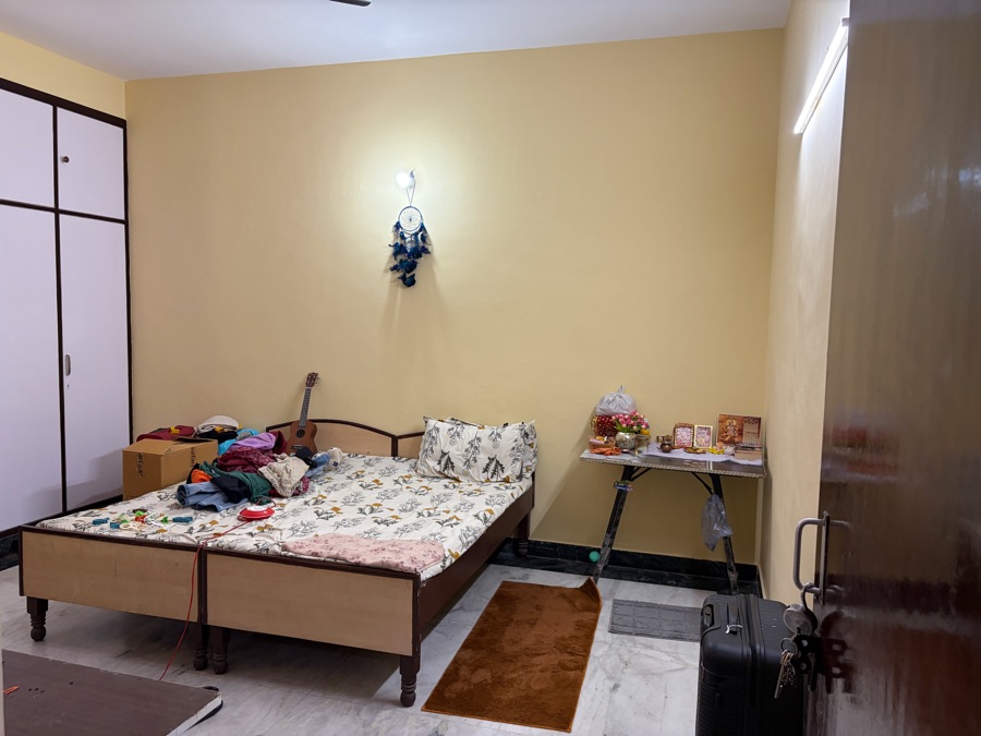 Room with wooden wardrobe and bed